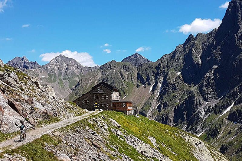 Mountain bikers on the way to the mountain hut in Tyrol