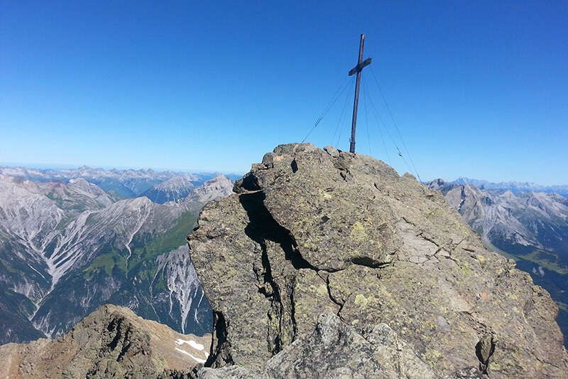 Summit cross in the mountains of Tyrol